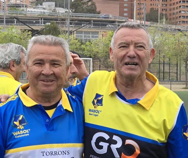 Two teammates sharing a smile during the league